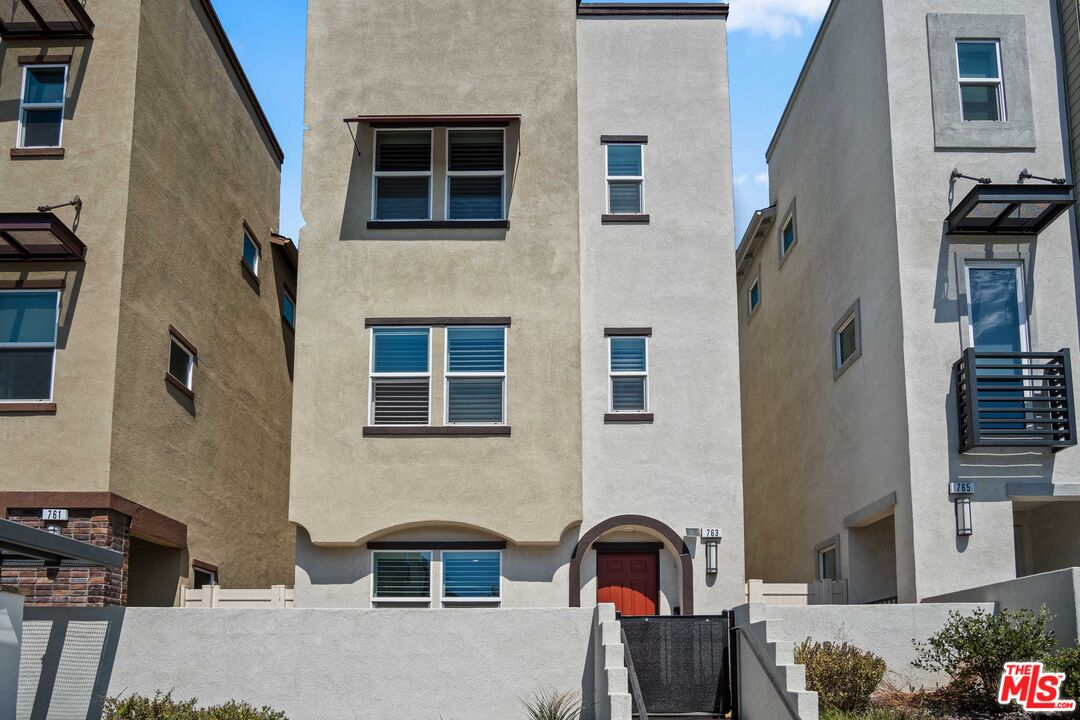 a front view of a house with parking space