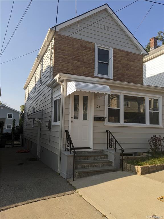 a view of house with a street