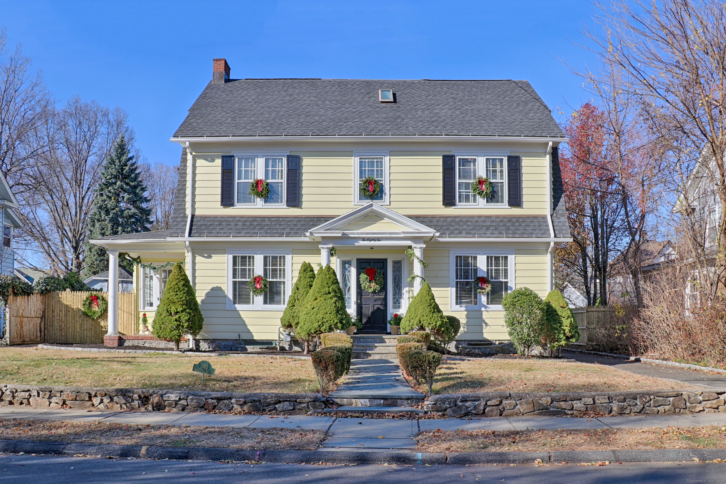 a front view of a house with garden