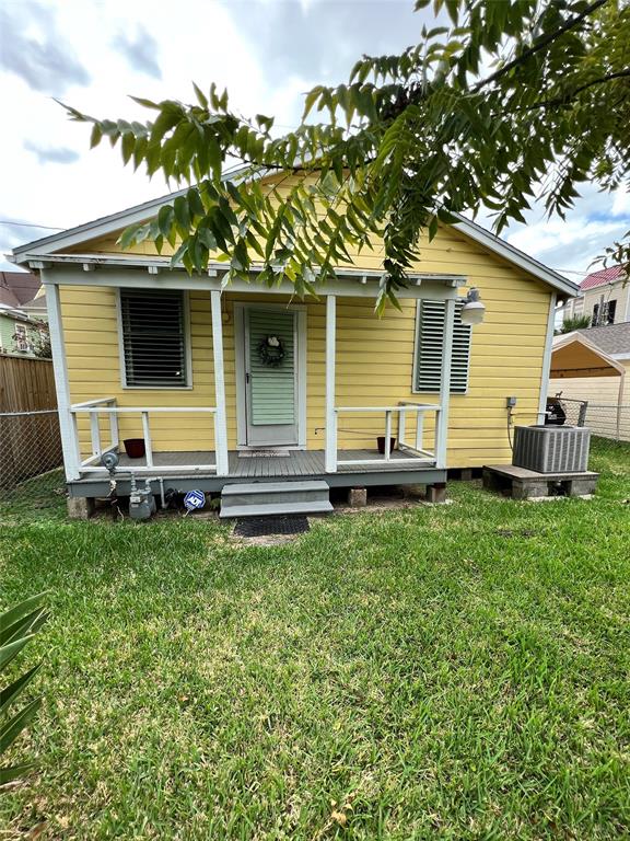 a backyard of a house with barbeque oven