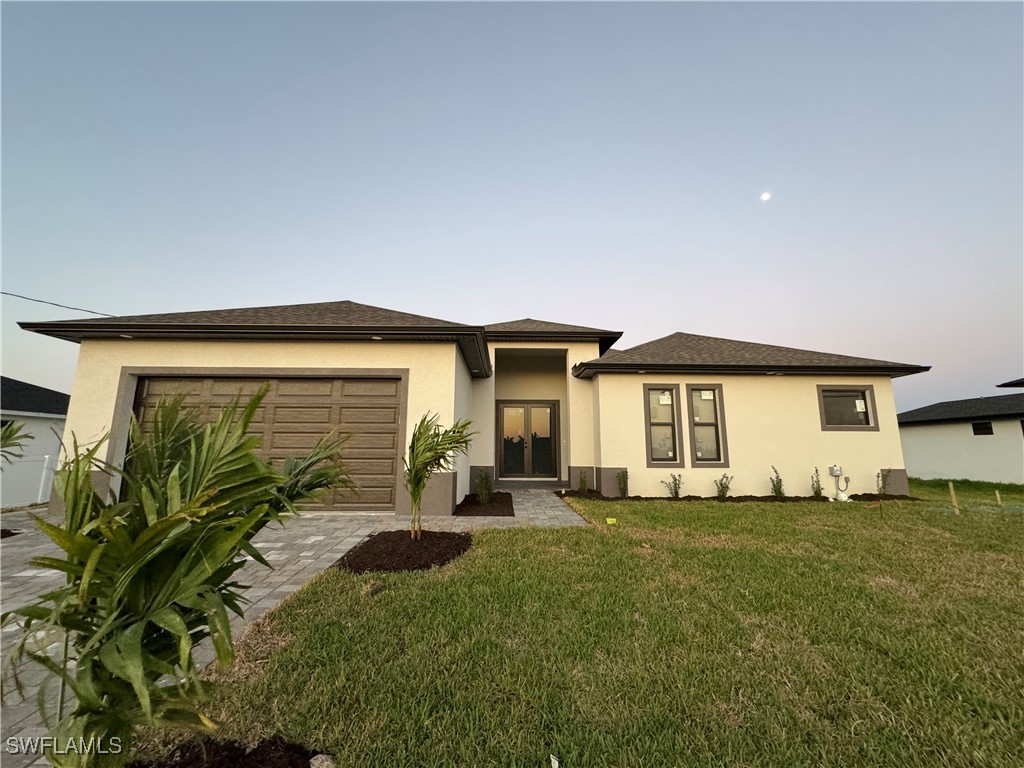 a front view of a house with a yard