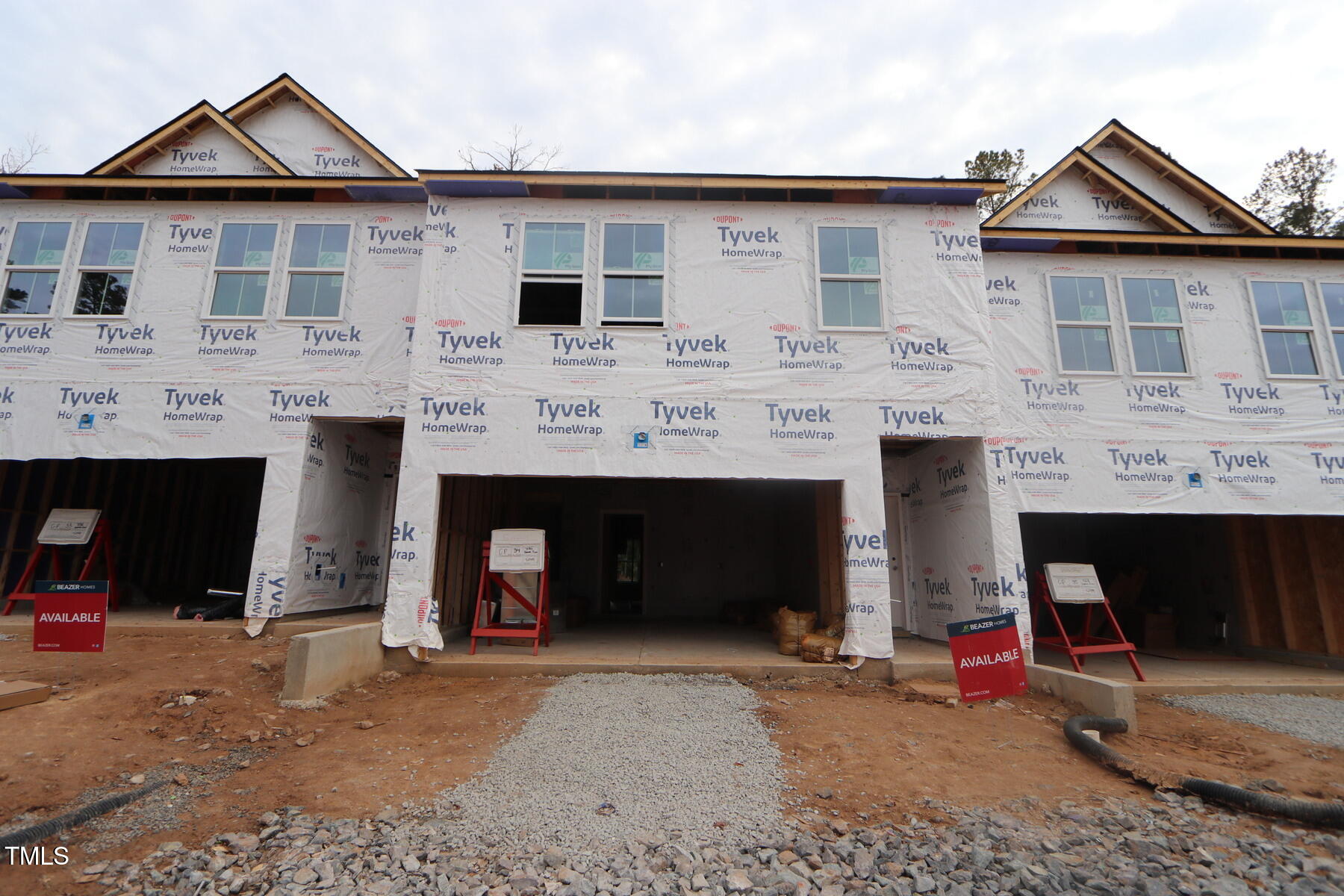 a front view of a house with a garage