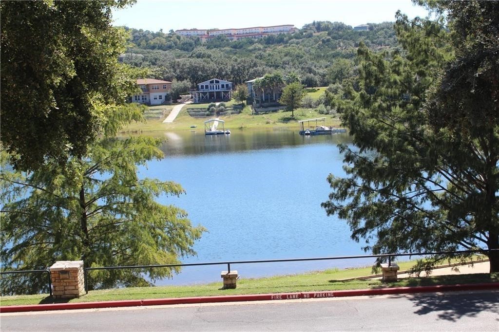 a view of a swimming pool with a lake view