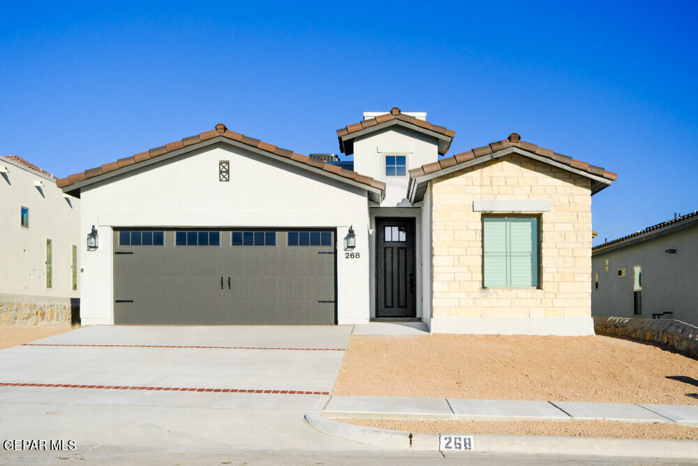 a front view of a house with a garage