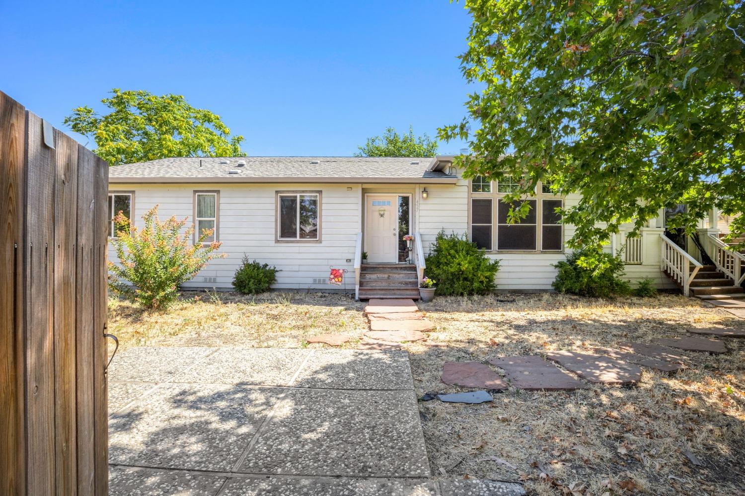 a view of a house with a yard