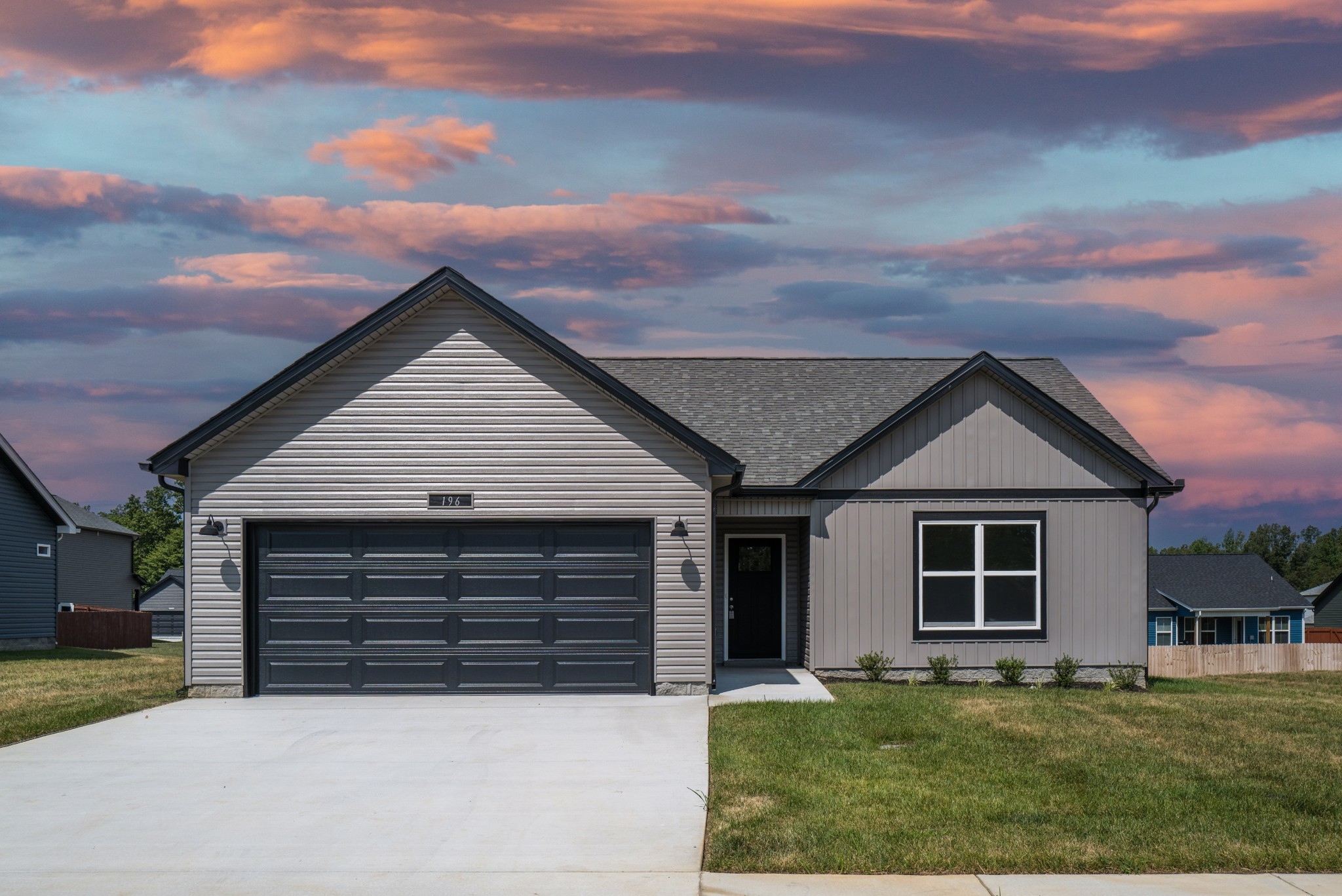 front view of a house with a yard