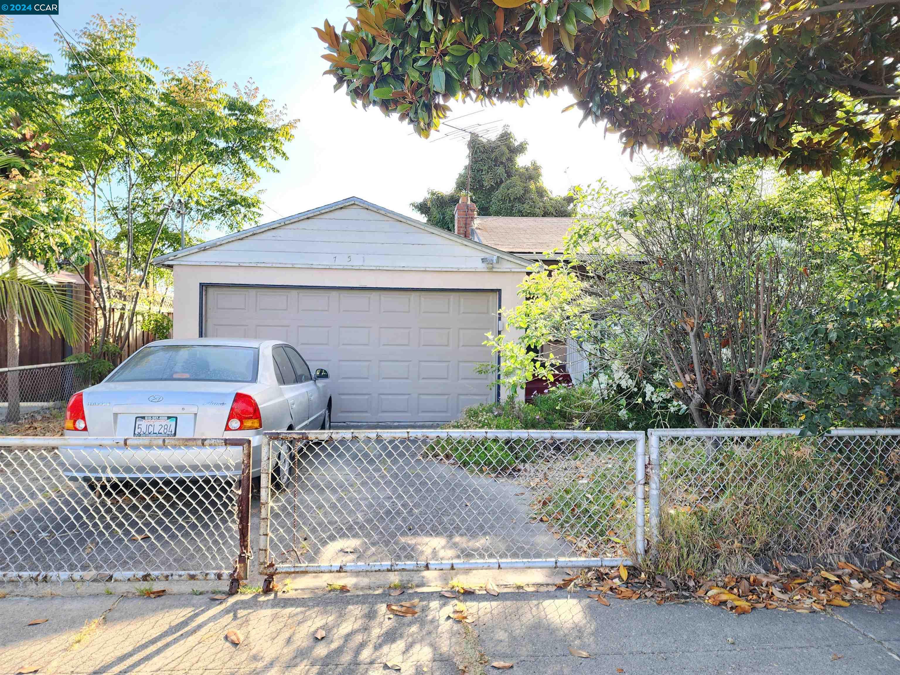 a front view of a house with a fence