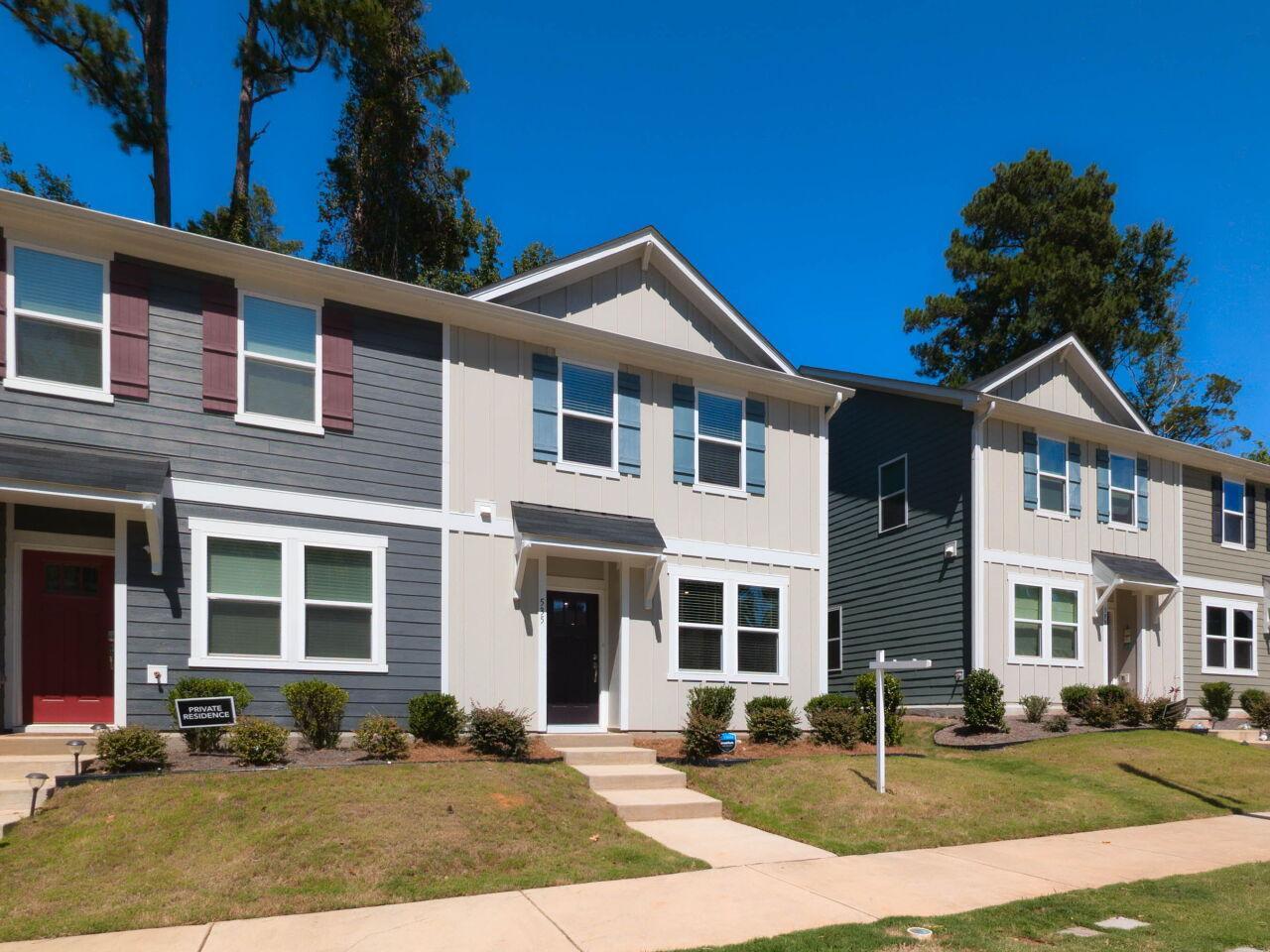 a front view of a house with a yard