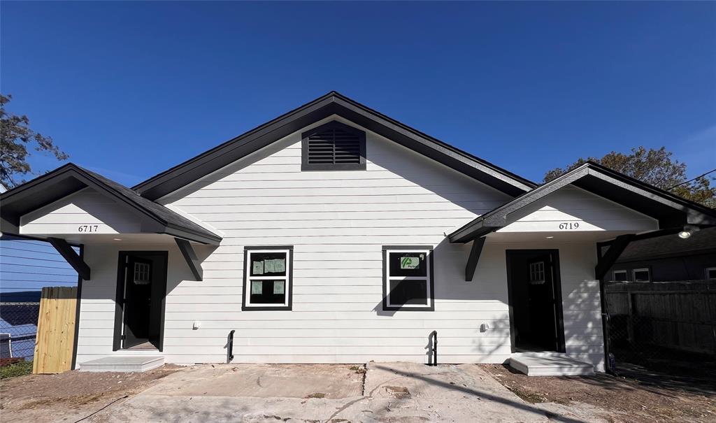 a front view of a house with garage