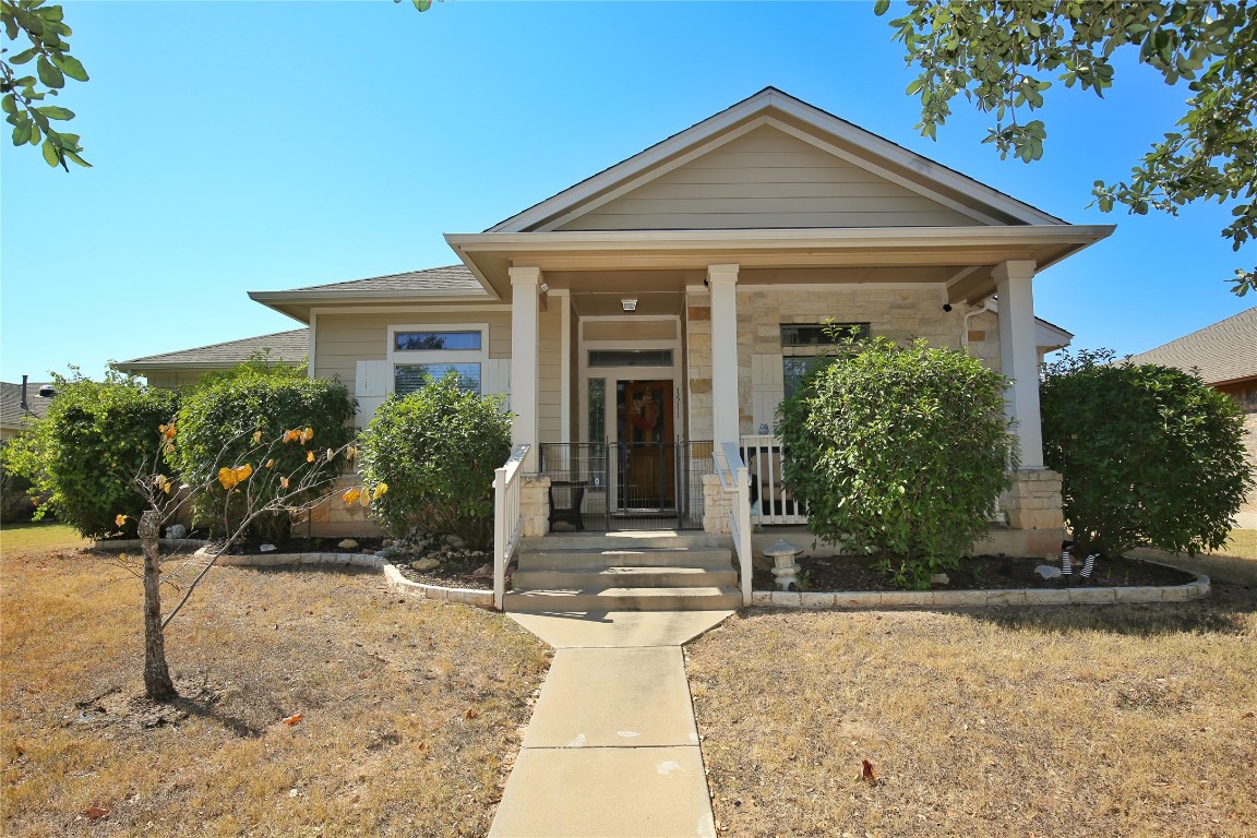 a front view of a house with garden