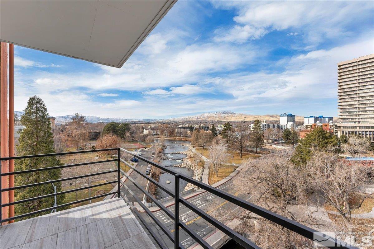 a view of a city from a balcony with city view