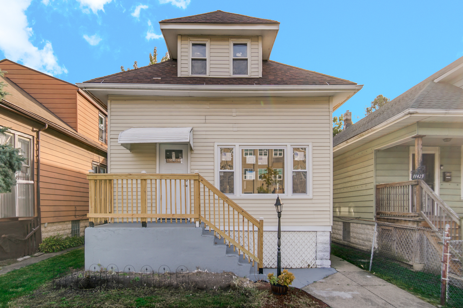 a front view of a house with a porch