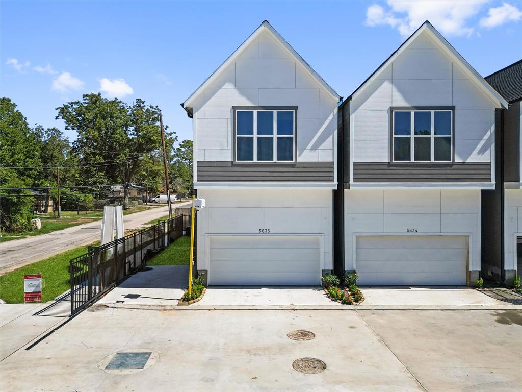 a front view of a house with garage