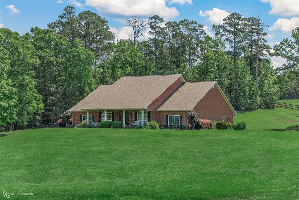 a aerial view of a house with a yard