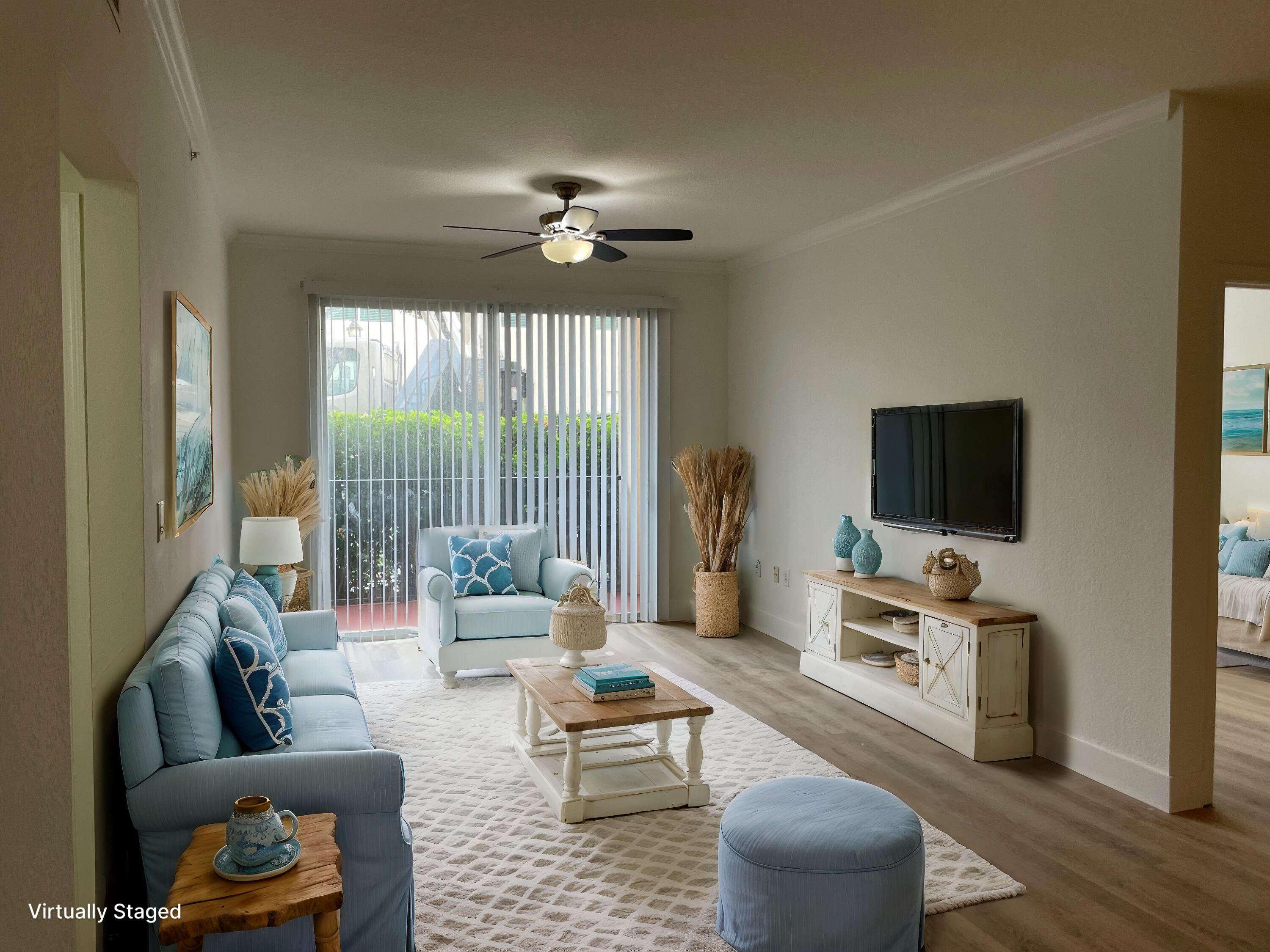 a living room with furniture and a flat screen tv