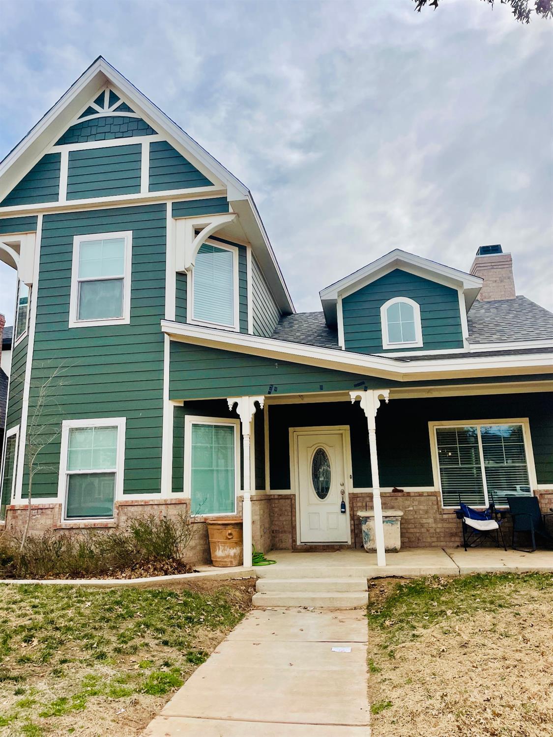 a front view of a house with a yard