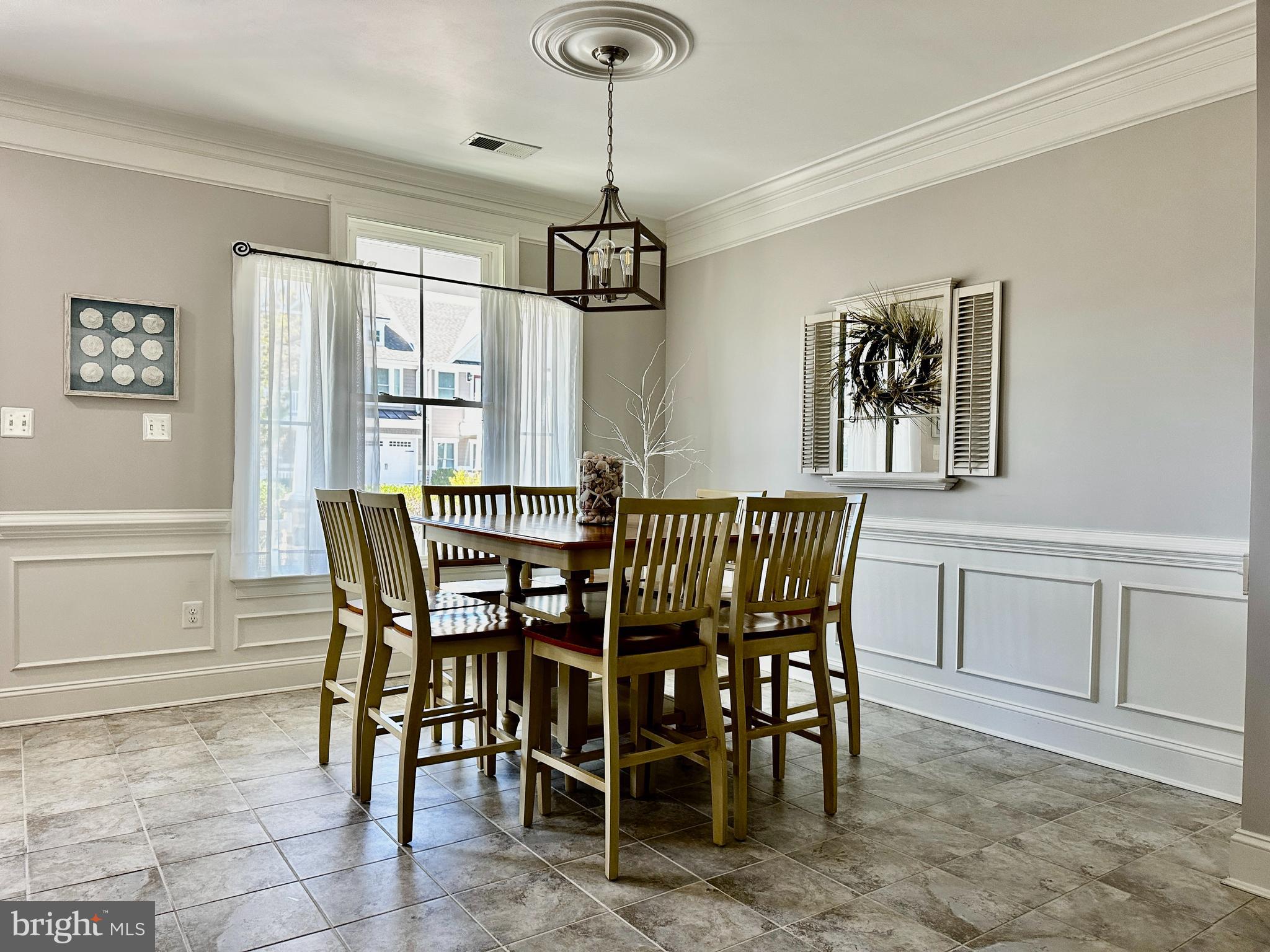 a dining room with furniture and window