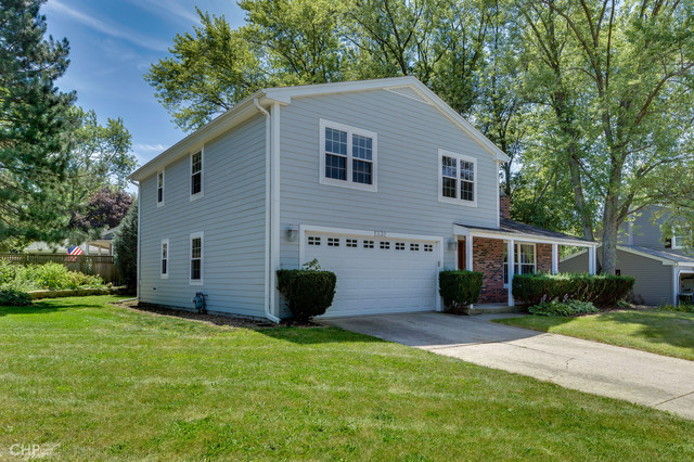 a view of an house with backyard space and garden