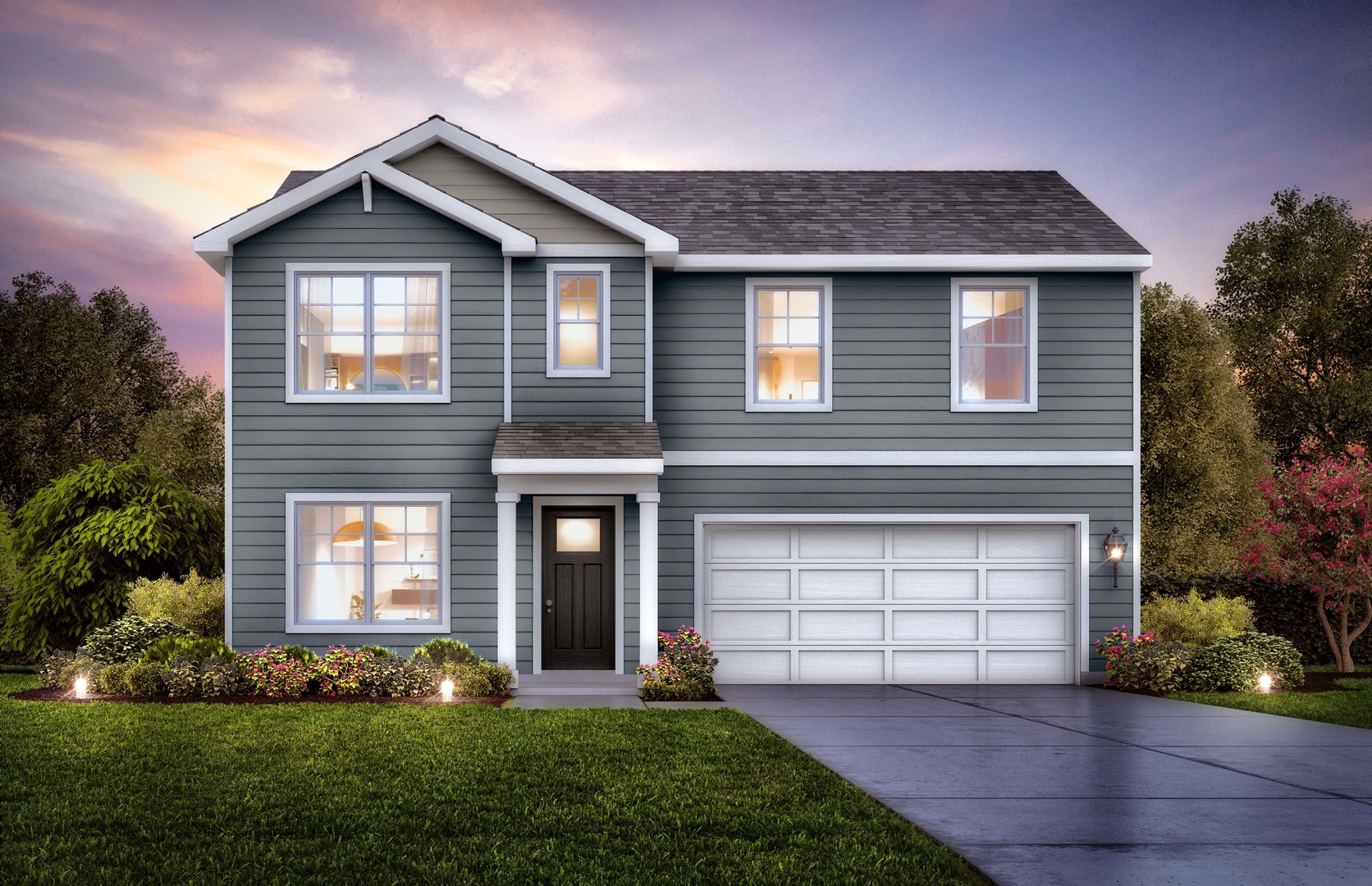 a front view of a house with a yard and garage