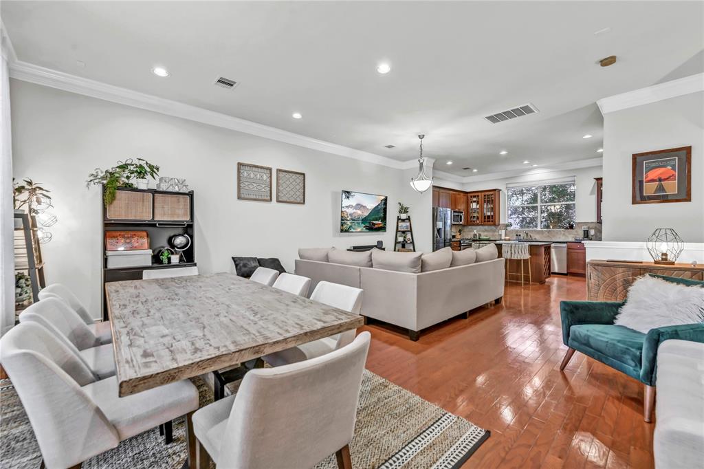 a living room with furniture kitchen view and a table