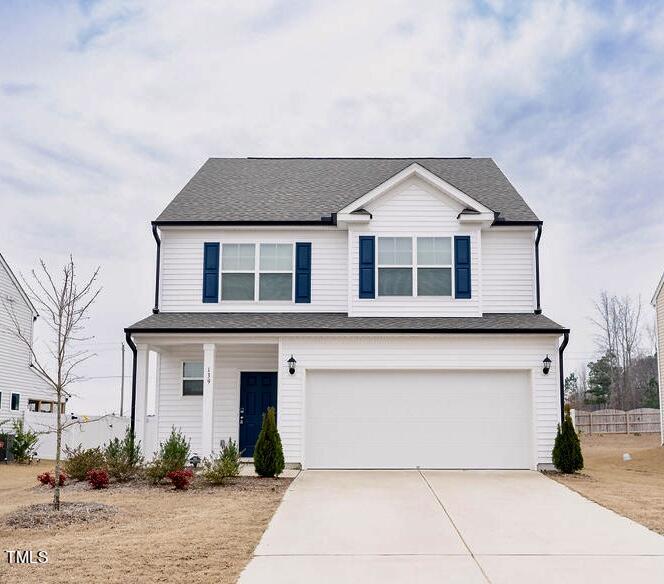 a front view of a house with garage