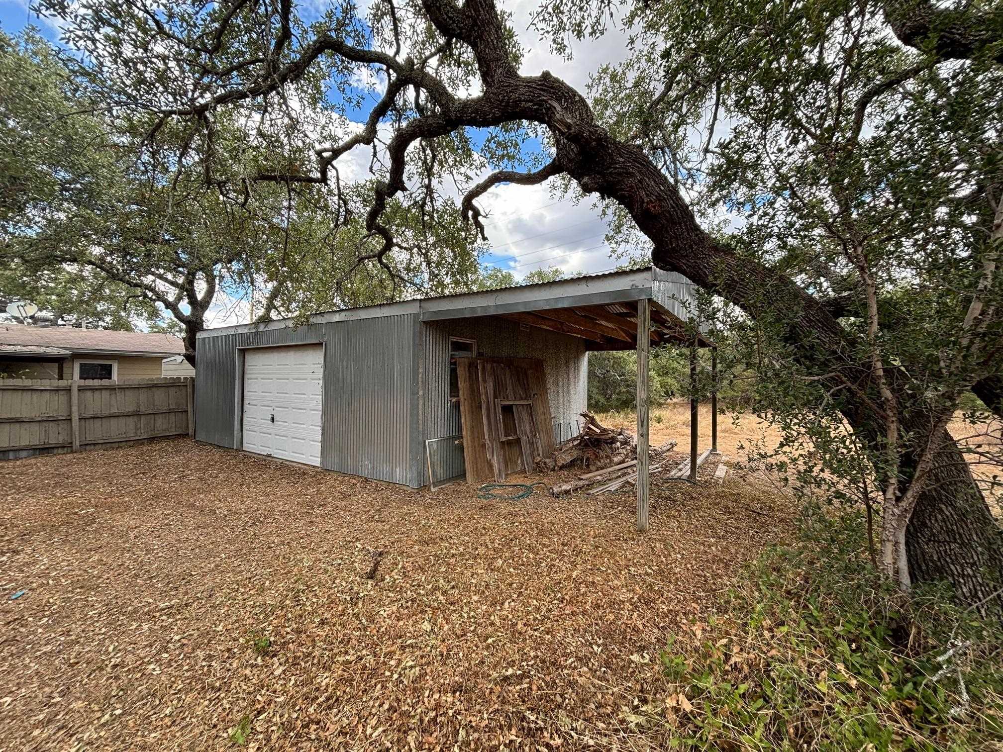 a view of a house with a tree