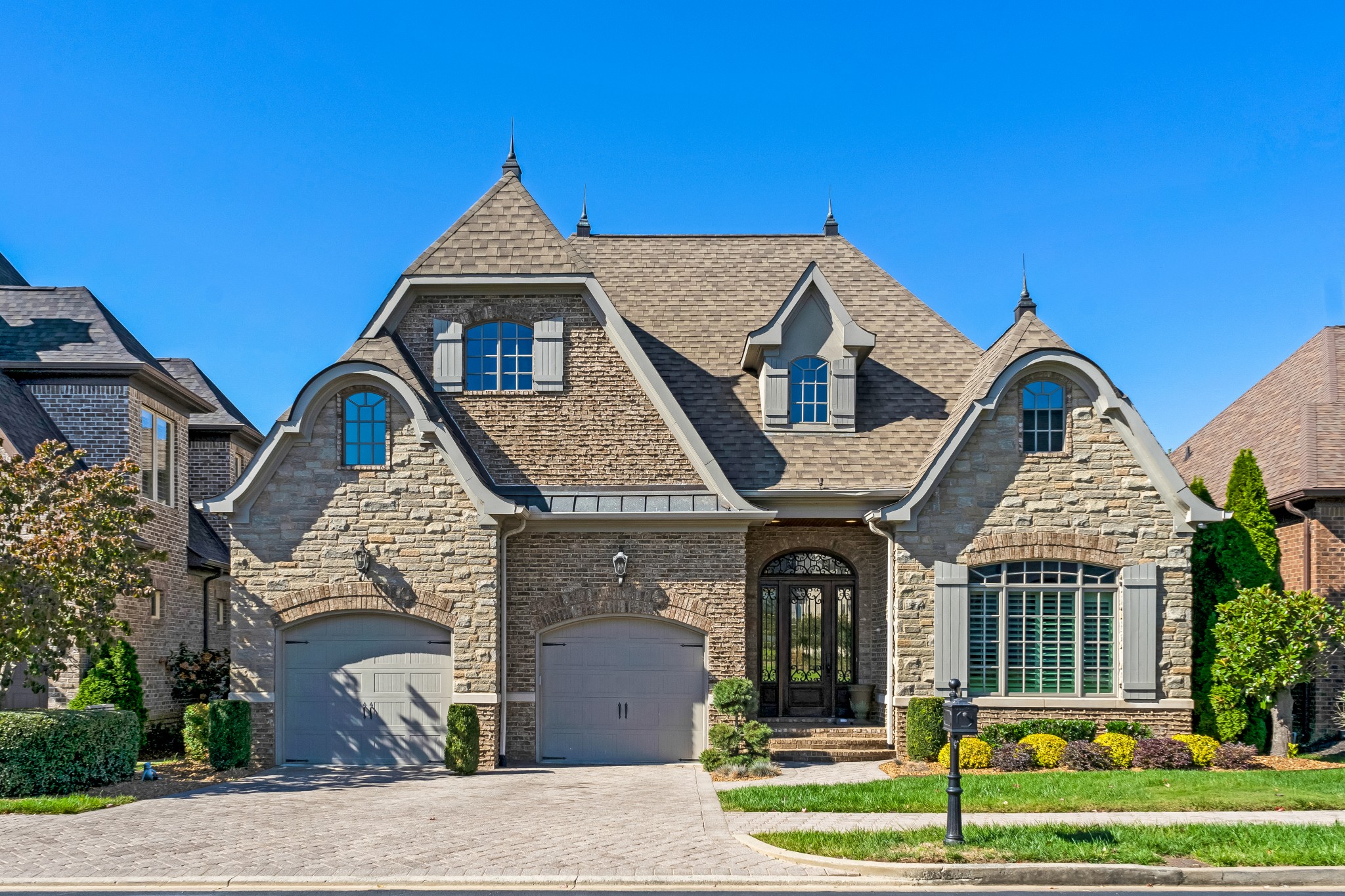 a front view of a house with garden