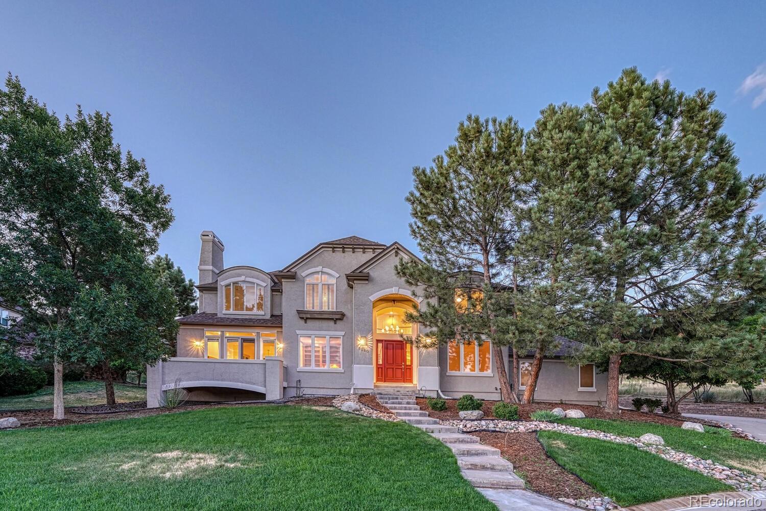 a front view of house with yard and entertaining space