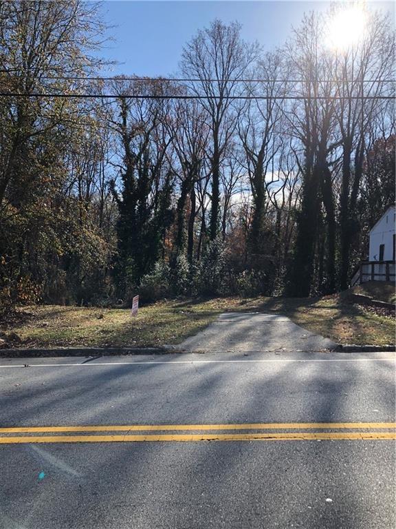 a view of a yard with large tree