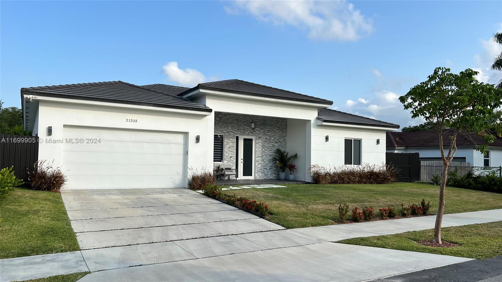 a front view of a house with a yard