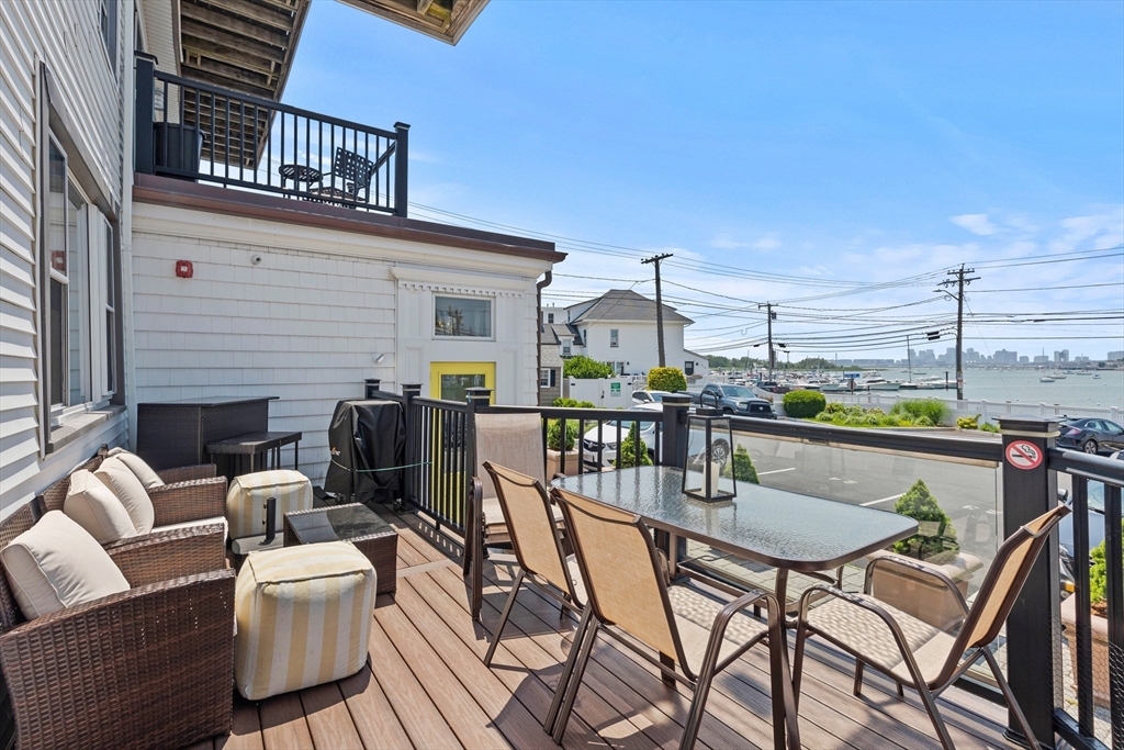 a view of a patio with table and chairs