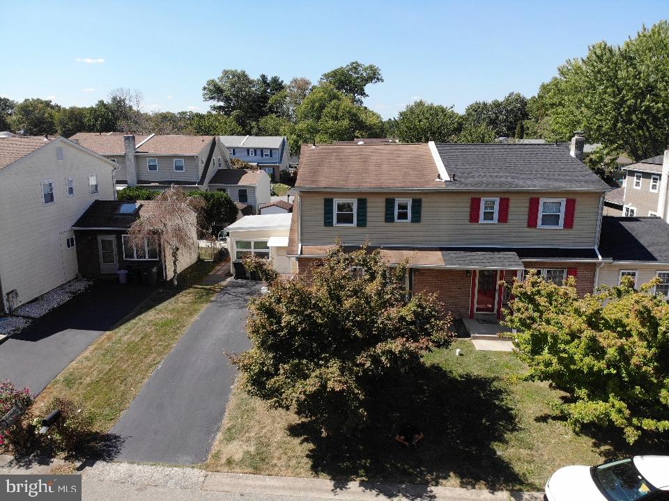 a view of a house with a yard and garden