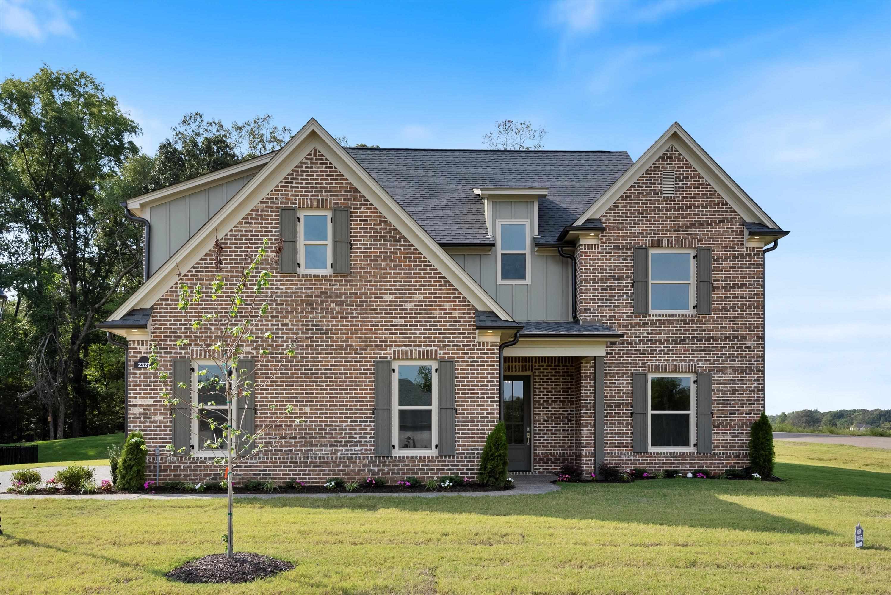 View of front of property with a front lawn