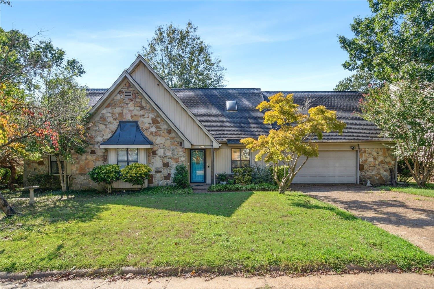 front view of a house with a yard