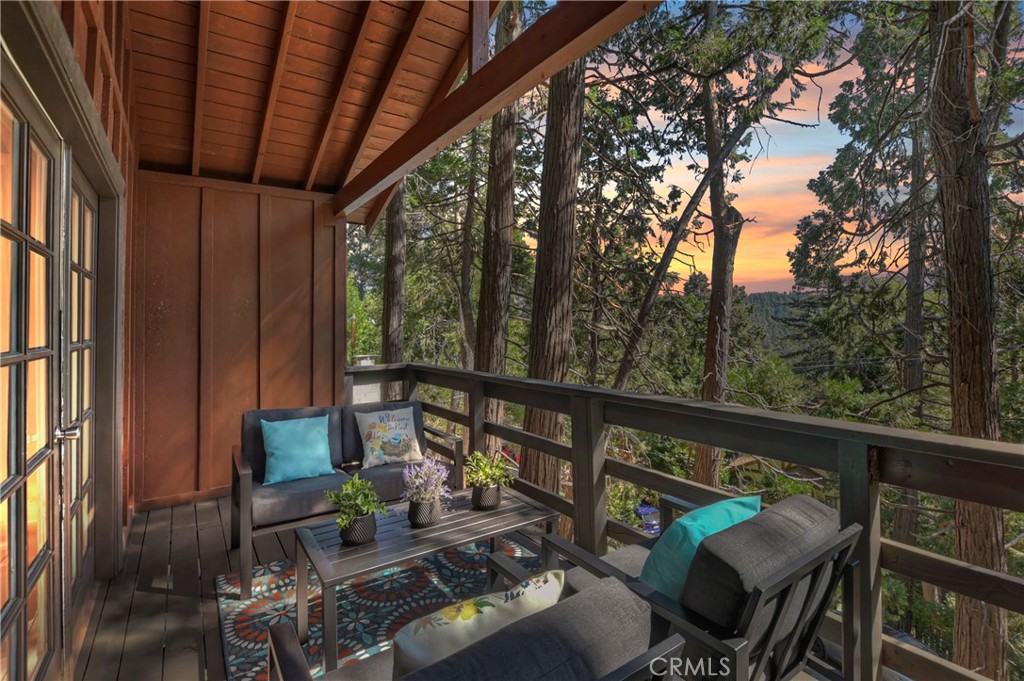 a view of roof deck with furniture