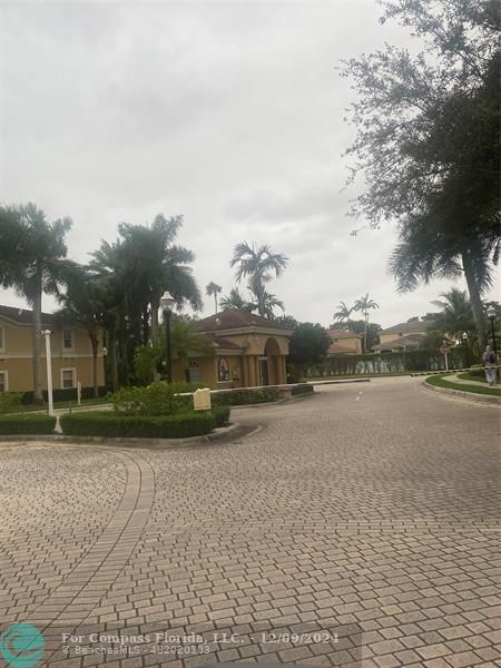 a view of a playground with basketball court