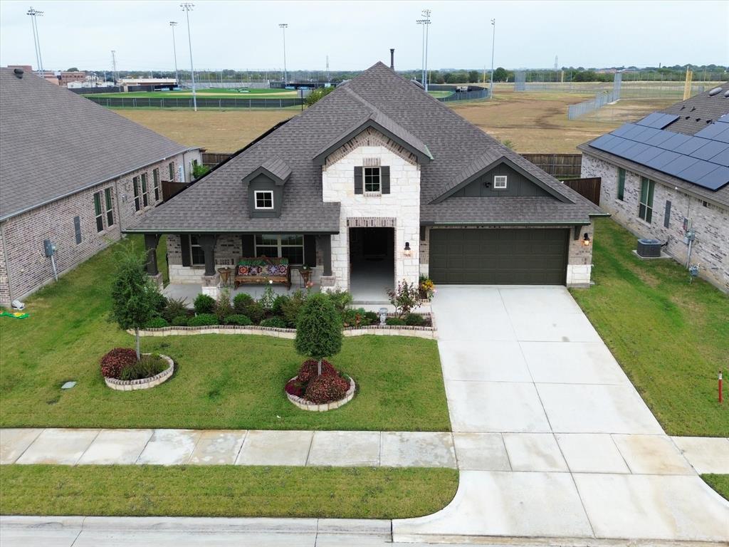 a view of a house with garden and yard