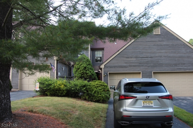 a view of house with backyard space and garden