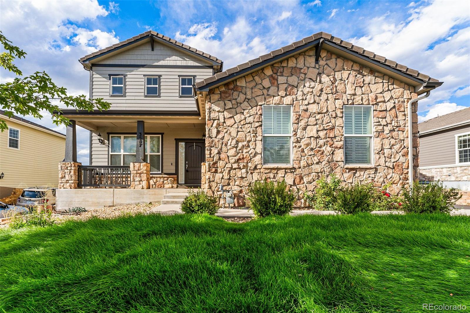 front view of a house with a yard