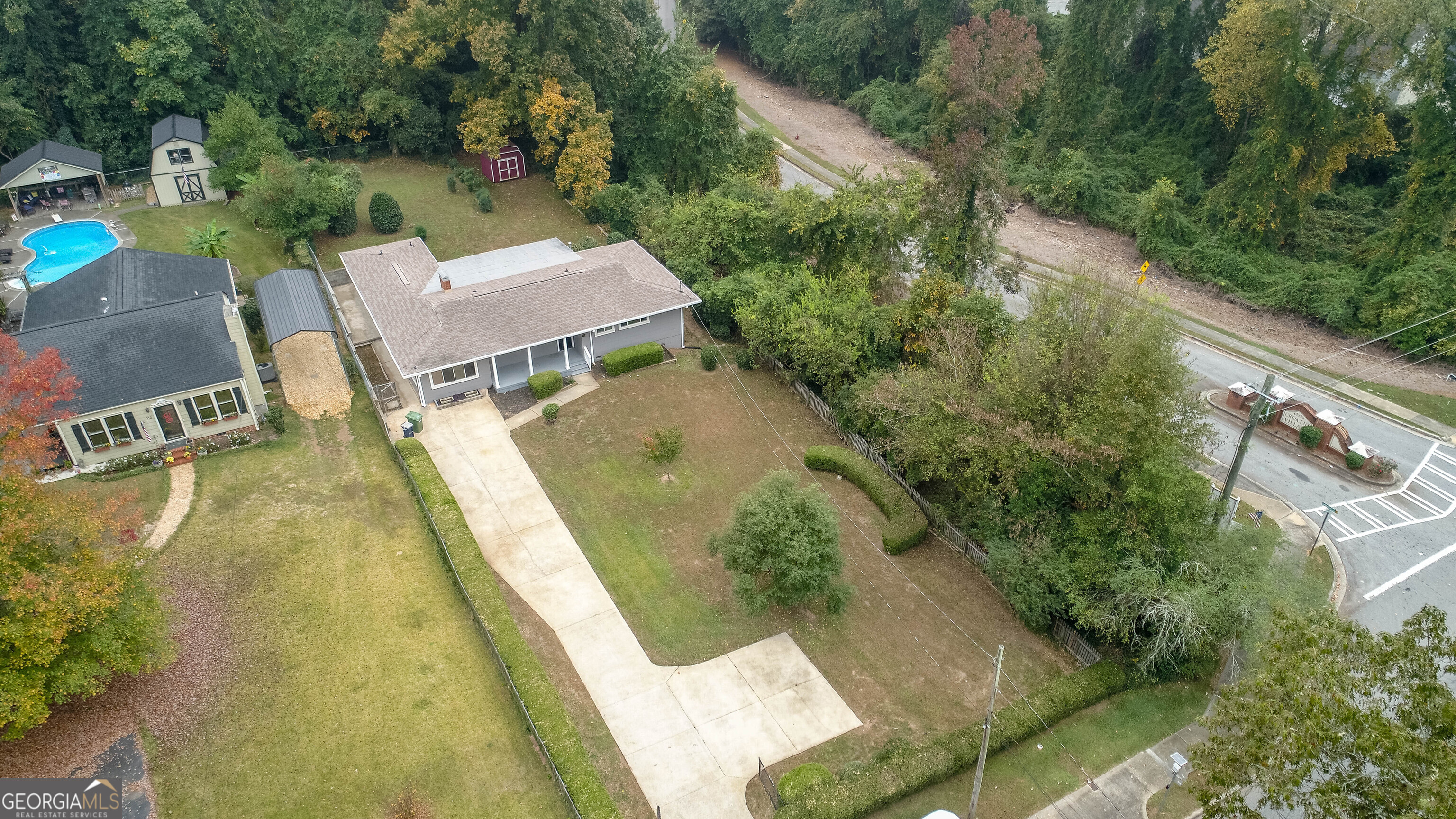 an aerial view of a house with swimming pool