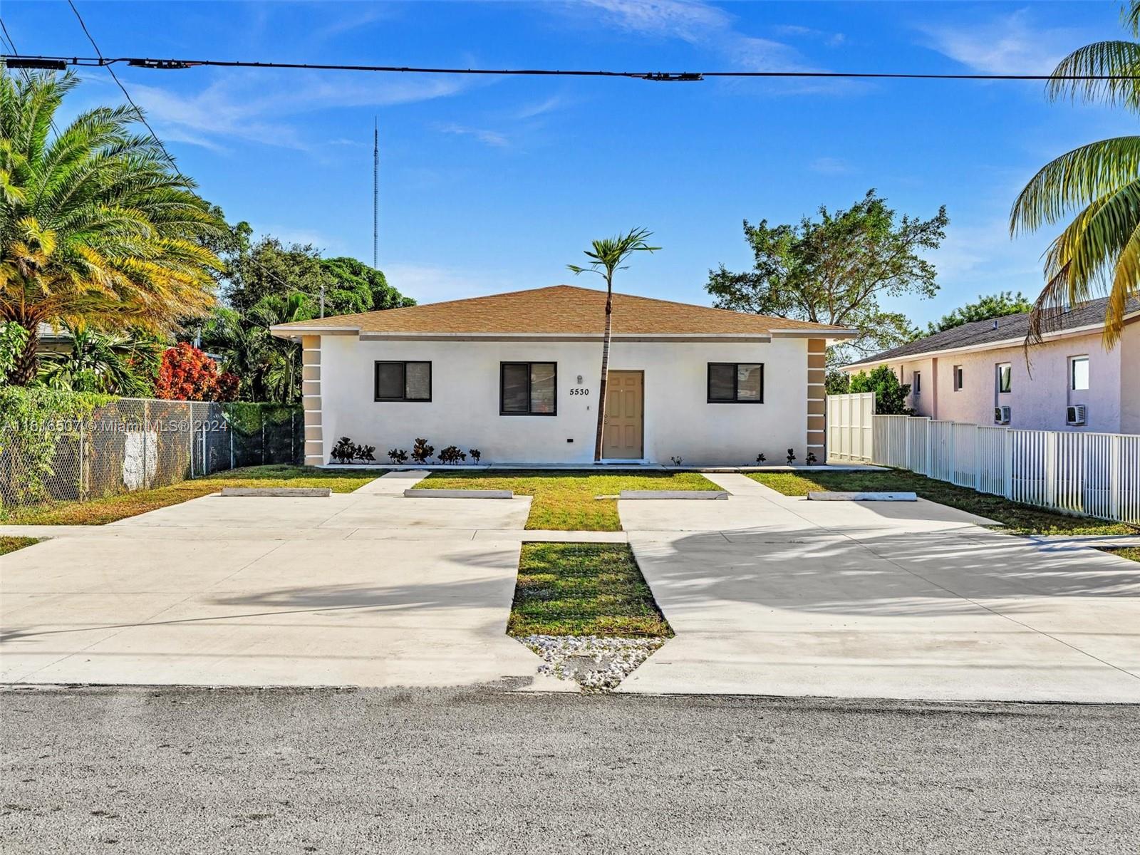 a front view of a house with yard