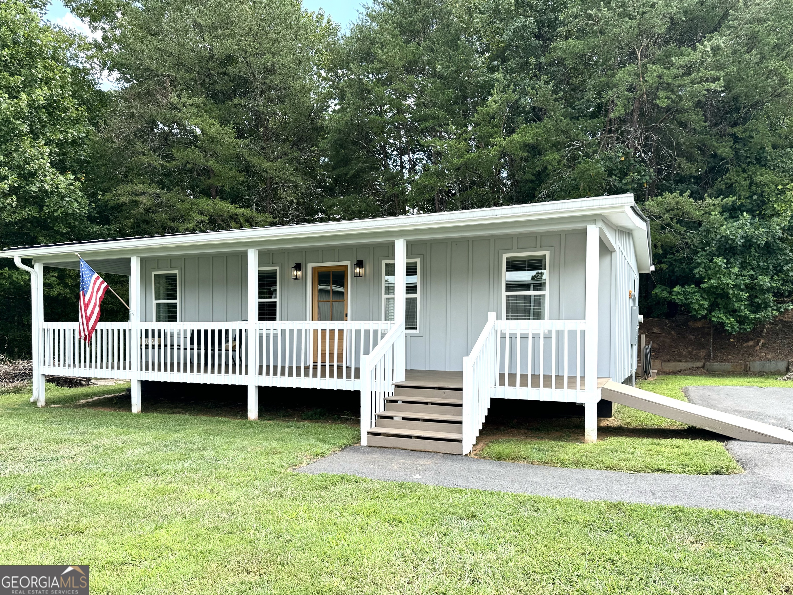 a view of backyard with deck and deck