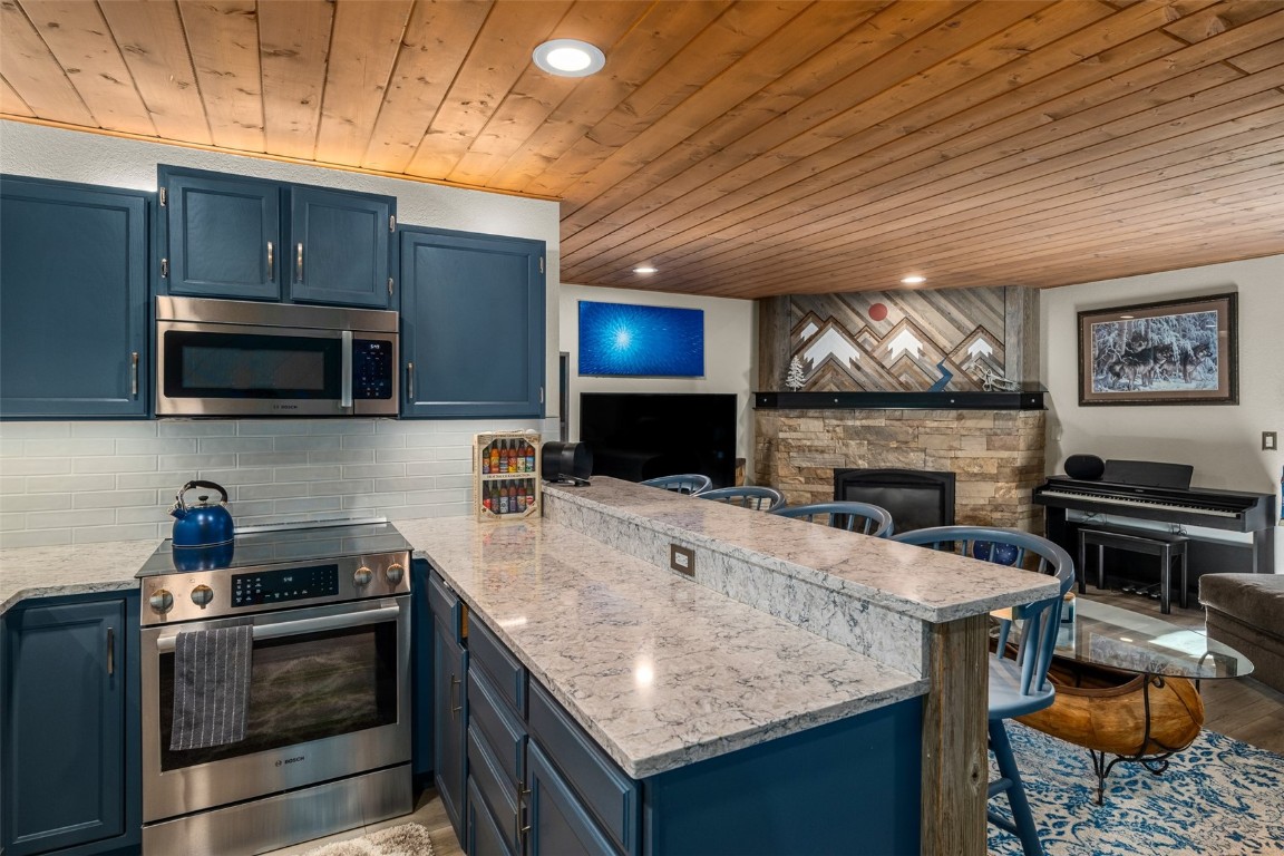 a kitchen with a stove and a microwave