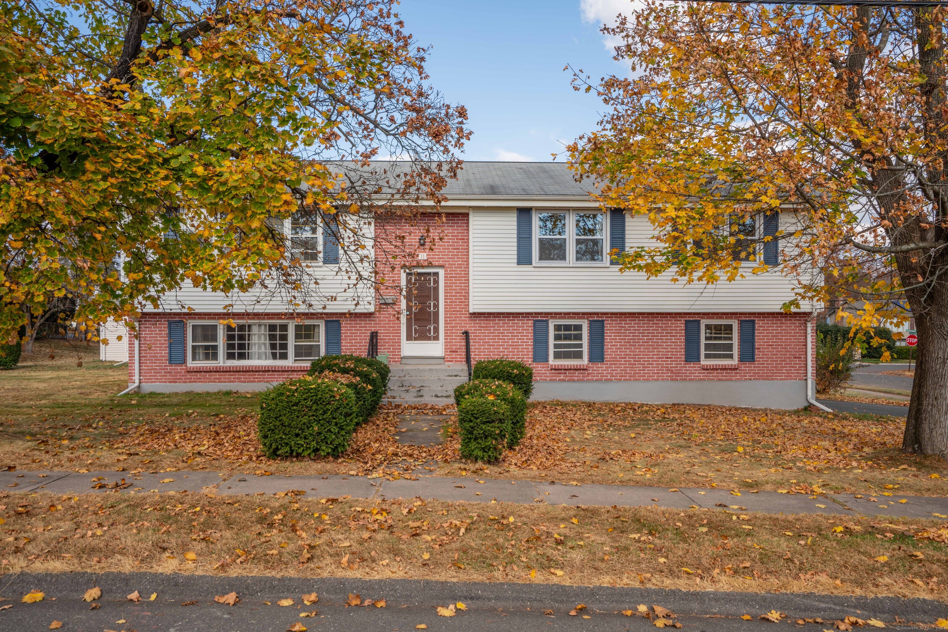 front view of a house with a yard