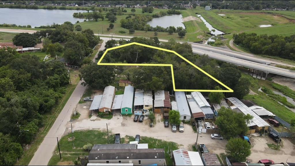 an aerial view of house with yard swimming pool and outdoor seating