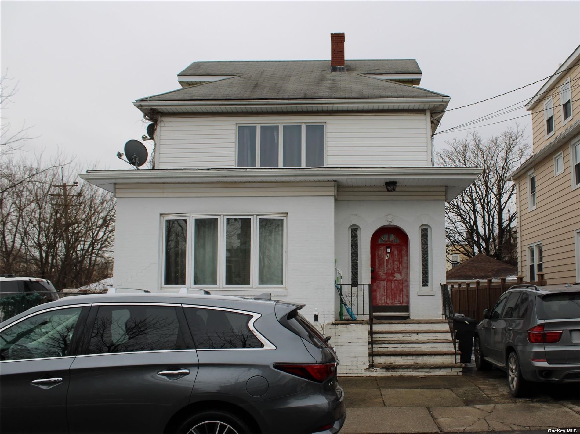 a view of a car parked in front of a house