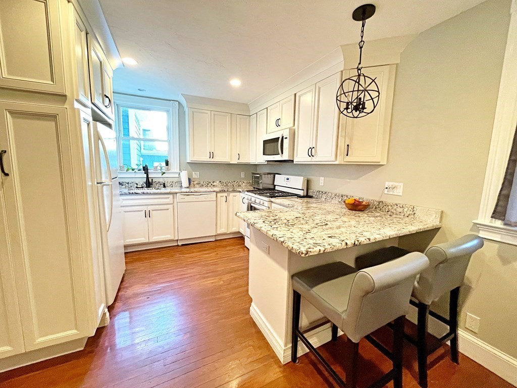 a kitchen with a table and chairs in it