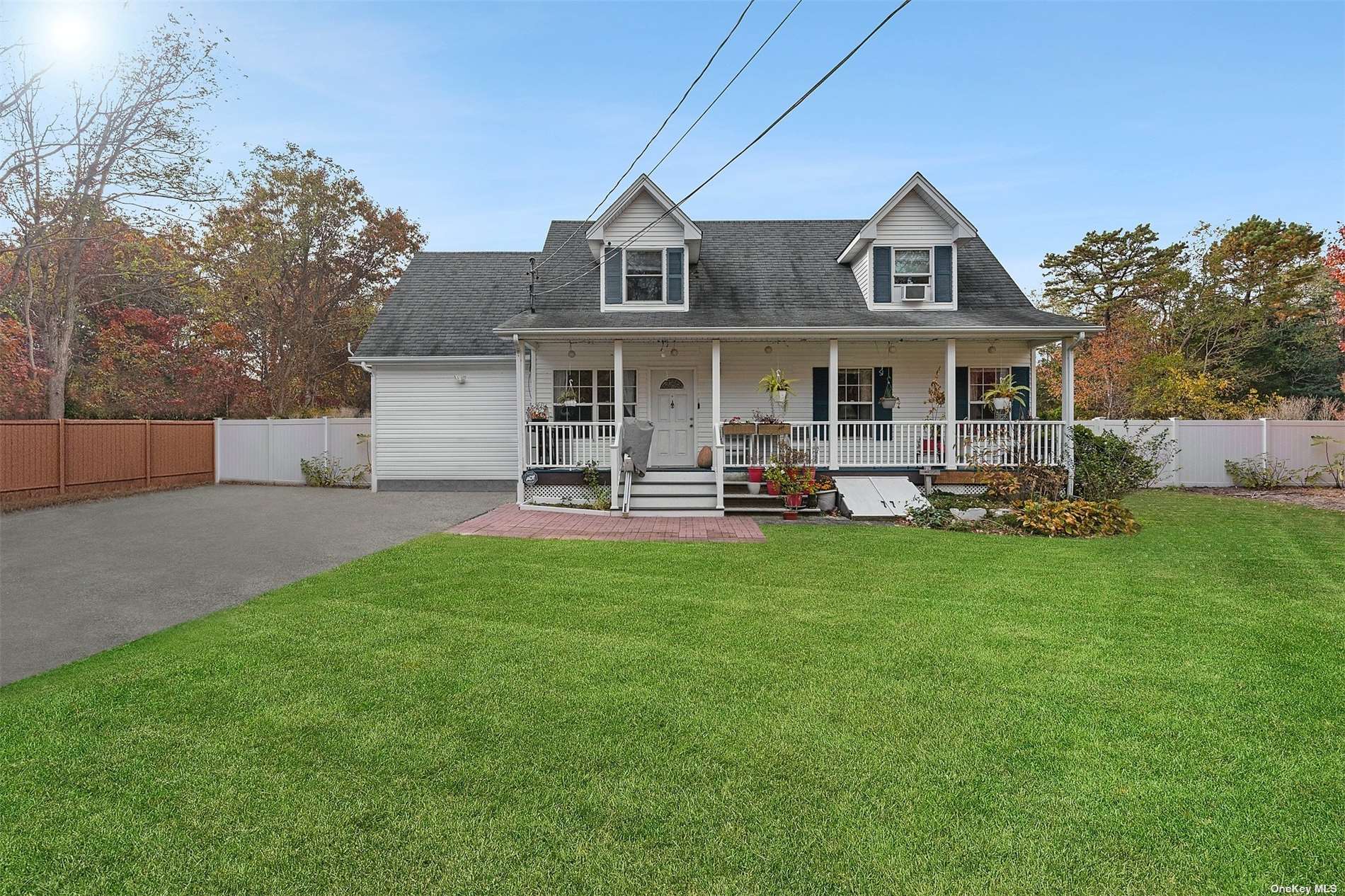 a front view of house with yard and outdoor seating