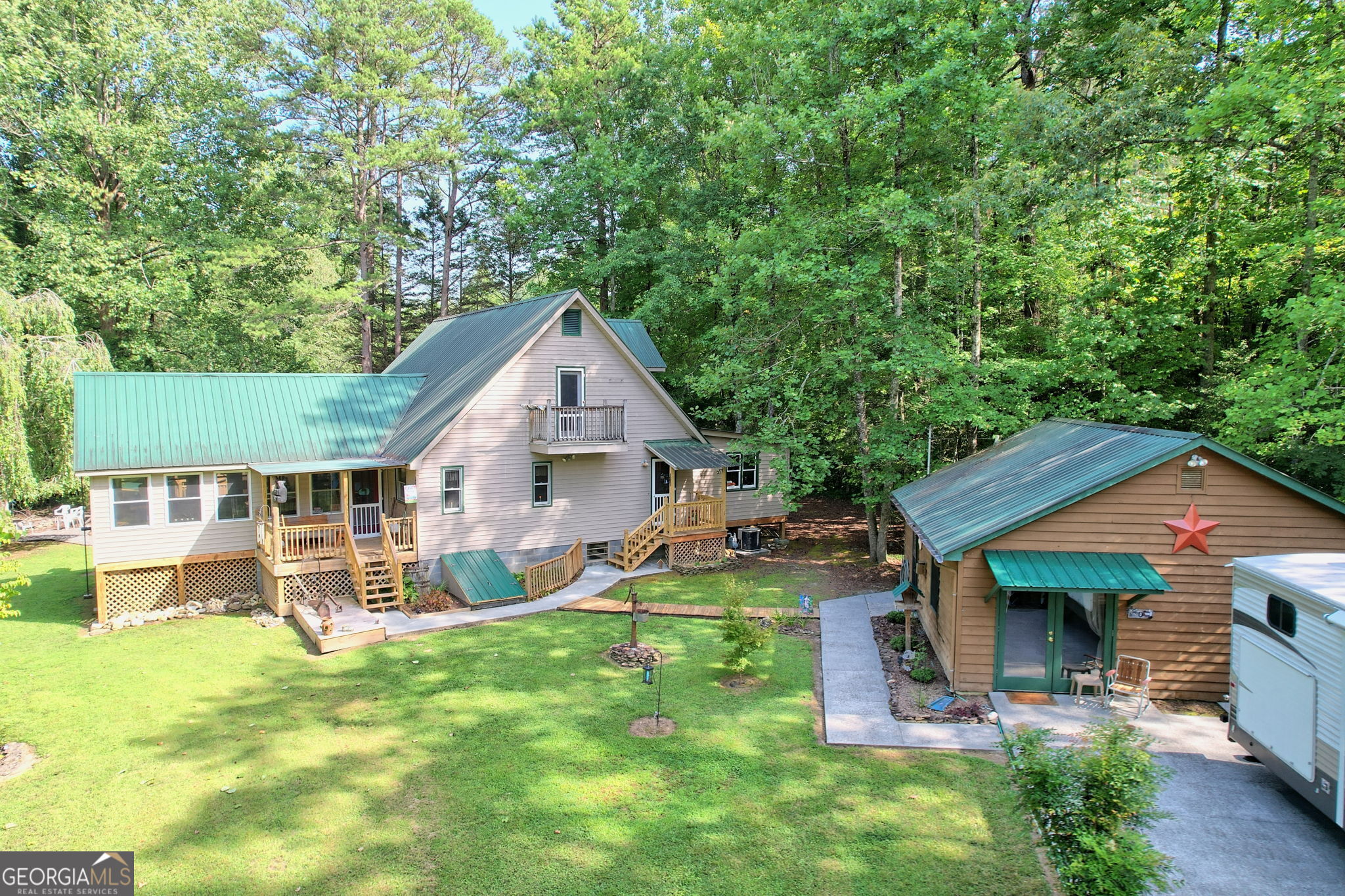 a view of a house with a yard patio and swimming pool