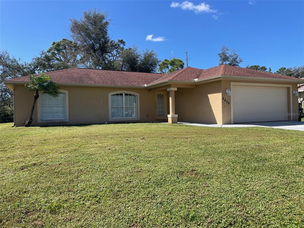 a front view of a house with a yard